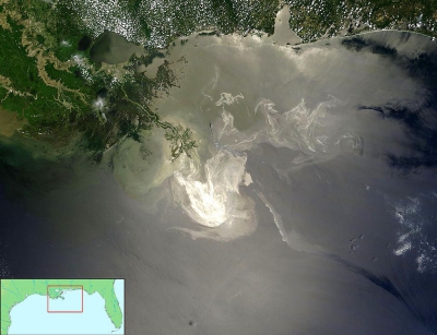 NASA image taken from its Terra Satellite on May 24, 2010 of the oil slick from the Macondo explosion and fire illuminated by sunlight (Photo credit: NASA)